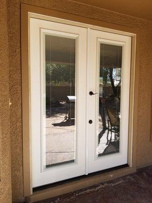 Therma Tru french doors with internal blinds.