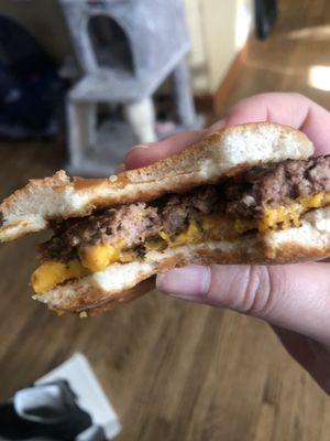 Quarter pounder with cheese-missing top slice of cheese.