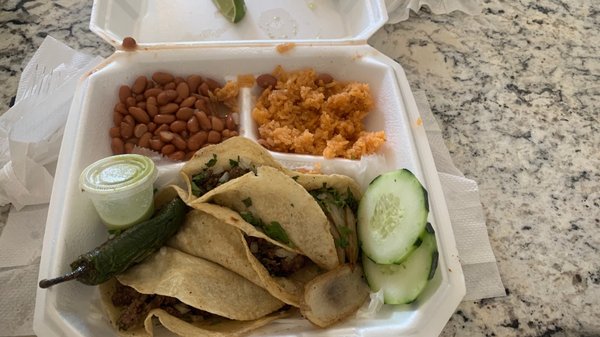 3 steak tacos, rice and beans with cucumbers