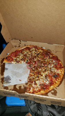 I just picked up this pizza and I took pictures after I'd already eaten some of it.