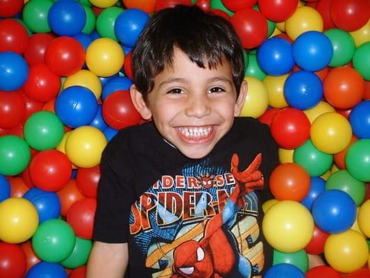 One of our friends...playing in the ball pit.