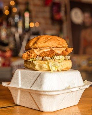 Buttermilk fried chicken, chipotle ranch, and shredded lettuce on a toasted Martin's soft roll