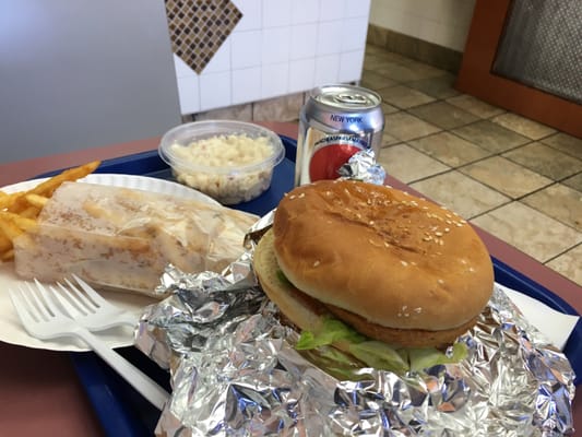 Two chicken sandwiches with fries and soda