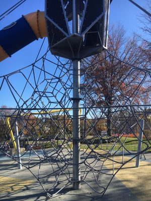 Rope ladder leading to slide.