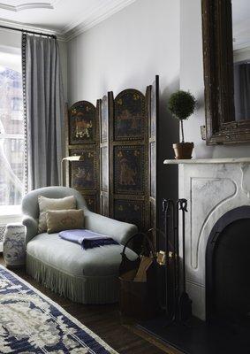 A cozy reading corner in a traditional home with Victorian touches.