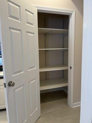 old shower area now a linen closet after