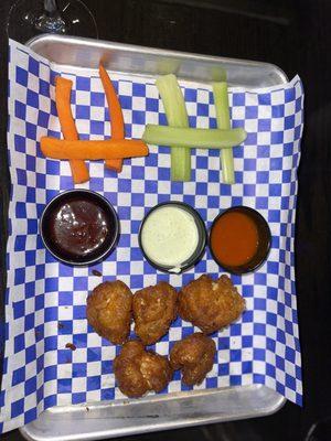 Fried cauliflower with buffalo, ranch, and thai chili on the side.