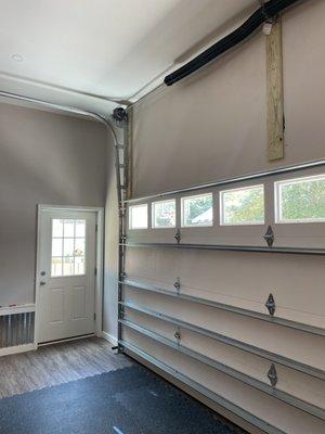 Convert your standard tracks and motor into a high-lift system to maximize headroom in garages with tall ceilings