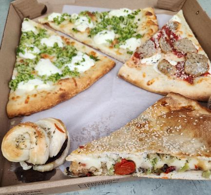 This is my to go box!  Meatball slice, Broccoli, garlic and White pizza slices!  Stuffed Veggie slice and an Eggplant Slider!