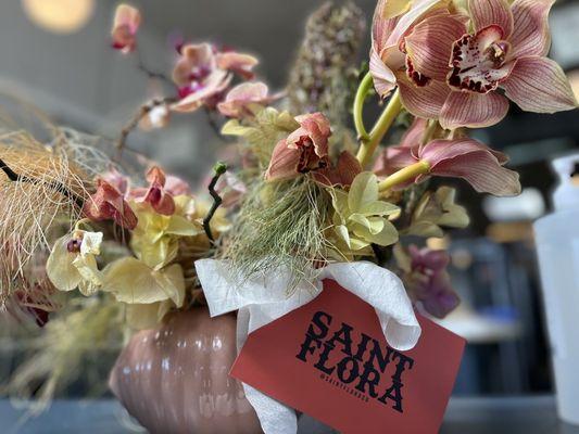 Beautiful floral arrangement that greets you at the door.