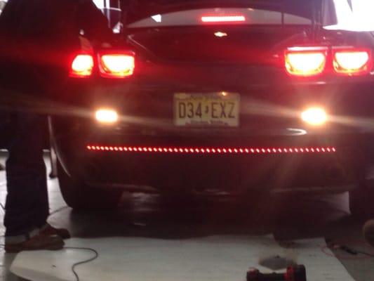 Getting my car pimped out with a new red tailgate bar light.