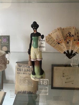 Racist memorabilia depicting a Black woman protesting for suffrage.