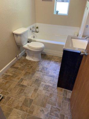 Garrett and Jordan did a fine job installing the linoleum in our upstairs bathroom.