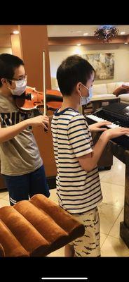 Young students playing a duet together