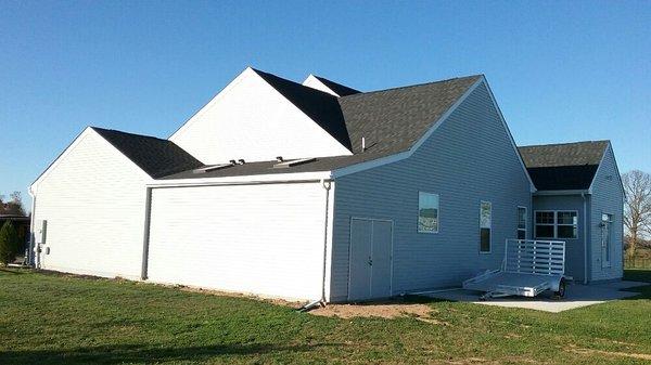 Storage addition with double steel doors and two skylights.