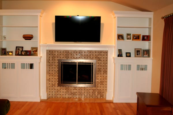 Update living room fire place wall with built in book shelves and new fire place facing...