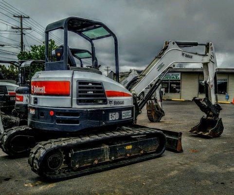 10,000 pound excavator with a variety of bucket sizes available. There is a closed cab option now available as well.