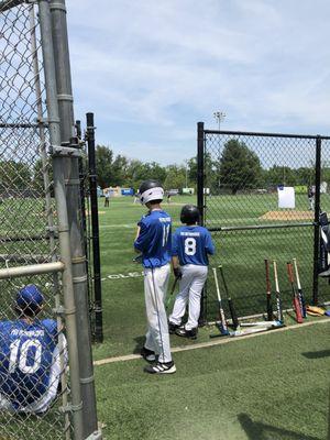 Players near the dugout (May 2022).