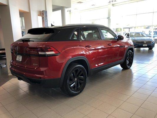 Atlas Cross Sport, with power coat black rims, blacked out chrome and top wrapped black.