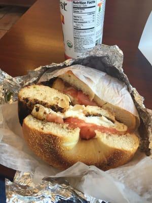 Egg white tomato and Swiss on a garlic bagel