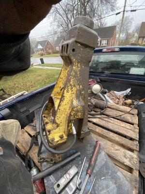 Rebuilding jack hammer attachment for a skid steer