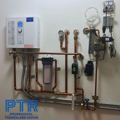 A complete water heater and filtration system completed by yours truly, Professional Trenchless Repair, the name to trust. Call us now!