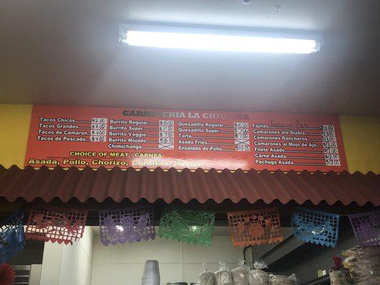 Menu of the taqueria inside the store