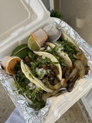 Pastor, beef fajitas, carne asada tacos (left to right)