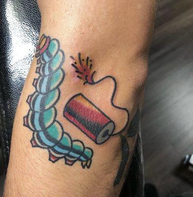 Fire cracker and caterpillar tattoo