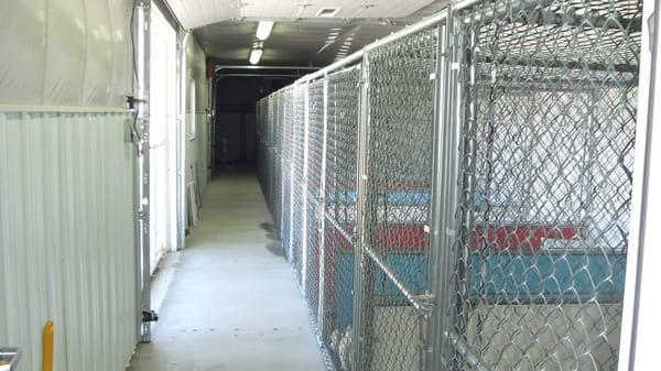 outer portion of the kennel.  The two portions are combined by a doggie door.  The outer portion has garage doors for fresh air.