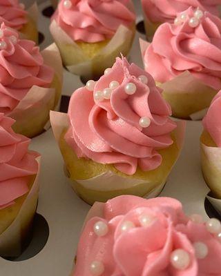 Our Mini Vanilla Cupcakes with pink frosting and pearl sprinkles