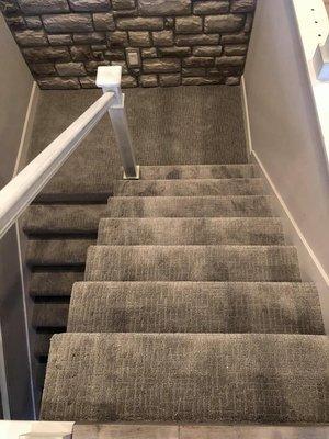 Stairs and landing are lovely in a soft basket weave pattern carpet.