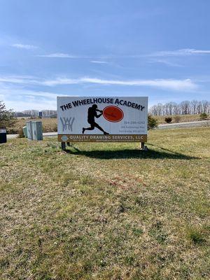 Outdoor Sign to Left of Building