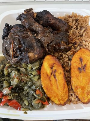 "Small" Jerk Chicken with rice & peas (with oxtail gravy), callaloo, and plantains. Run, don't walk here!