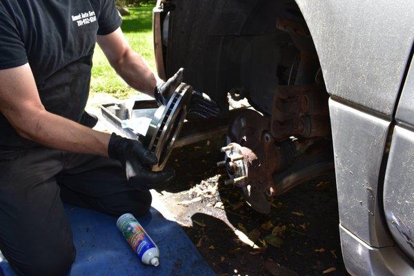 Replacing brakes at a customer's home in Spring Valley