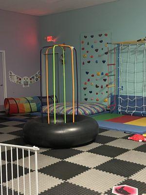 We have a rock wall, climbing set with monkey bars, and a jungle jumperoo.  Including lots of sensory and textile toys on the walls.