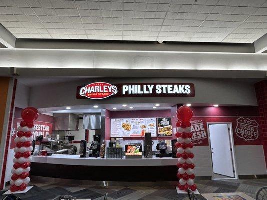 The front counter and sign at Charleys Cheesesteaks.