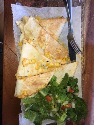 Chicken and cheese quesadilla with corn. Added with salad on the side.