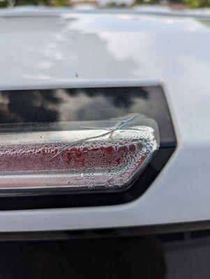 Broken third brake light, from car wash.