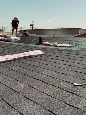 Worker installing roof