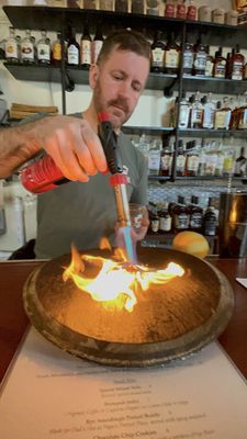 Len preparing a smoked cocktail