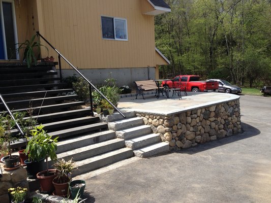 Granite steps with stonewall and bluestone patio.