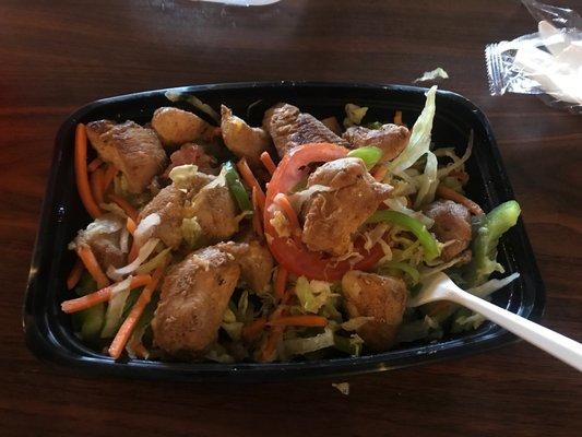 Grilled chicken salad comes with lettuce, tomato, carrots, bell peppers, and avocado.