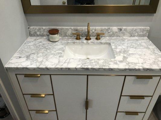 New Carrera Marble vanity brushed fold hardware and fixtures