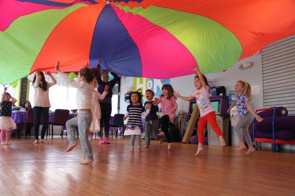 Parachute time during a birthday party at H2K - so much FUN!!