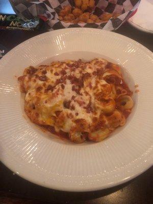 Baked tortellini beef and marinara sauce.