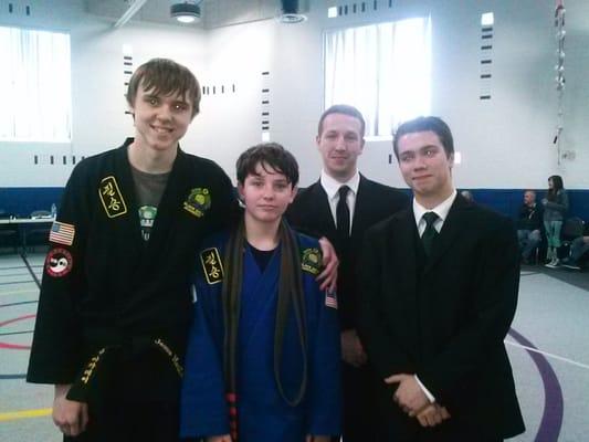 My son with his instructors after his black belt test they were all there to support him