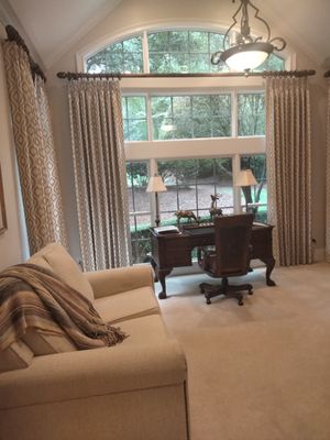 Custom hand made French pleated side panels with designer fabric is the perfect fit for this home office.