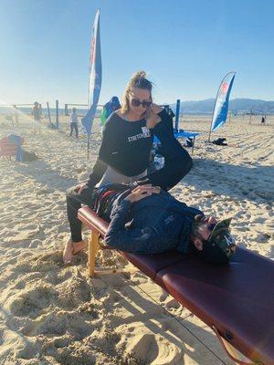 Giving Ola Beach Tennis players stretch sessions on the beach