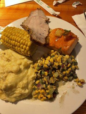 Mashed potatoes, corn, pork loin, teriyaki salmon, roasted corn and poblano salad.